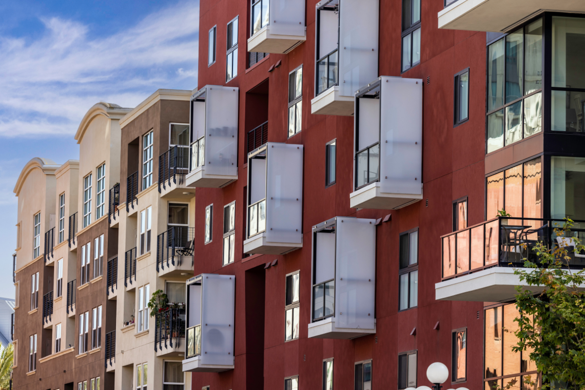 Modern multifamily apartment buildings with balconies in Southern California, representing high-LTV real estate investment opportunities in a Delaware Statutory Trust structure